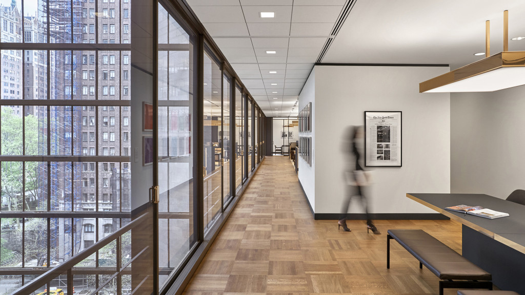 A person walking in a hallway.